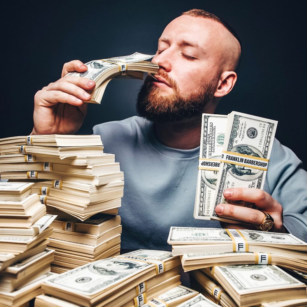 A man smelling money